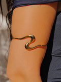 Brazalete fino ola dorado
